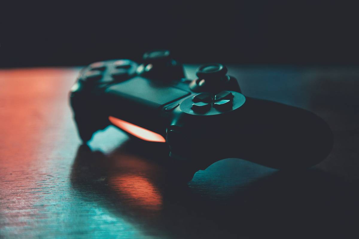 gaming accessory ps4 how to control – close-up of DualShock 4 controller with labeled buttons and connection ports